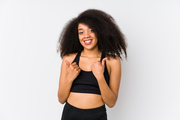 Young african american sporty woman raising both thumbs up, smiling and confident.