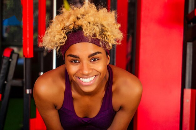 Young african american woman activity working out in gym indoor