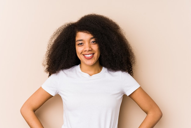 Young african american woman confident keeping hands on hips.