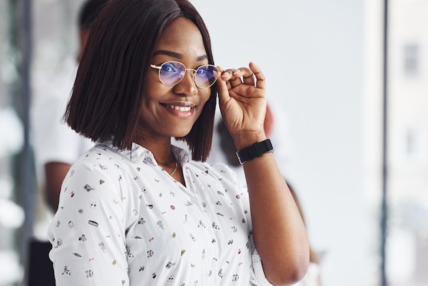 Young african american woman in formal clothes is in the office