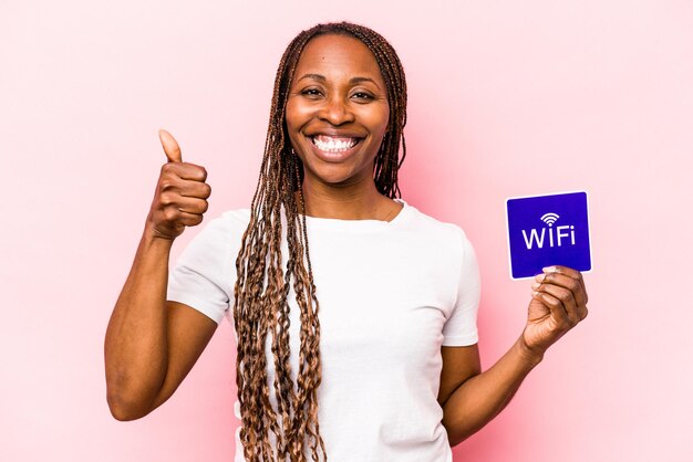 Young African American woman holding no eating sign isolated on blue background