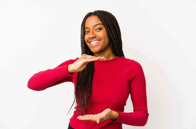 Young african american woman holding something with both hands