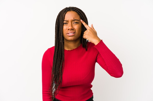 Young african american woman isolated showing a disappointment gesture with forefinger.