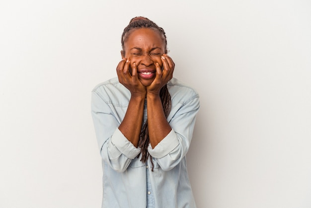 Young african american woman isolated on white background crying, unhappy with something, agony and confusion concept.