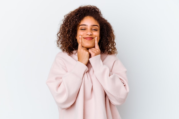 Young african american woman isolated on white background doubting between two options.