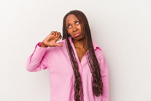 Young african american woman isolated on white background showing a dislike gesture, thumbs down. Disagreement concept.