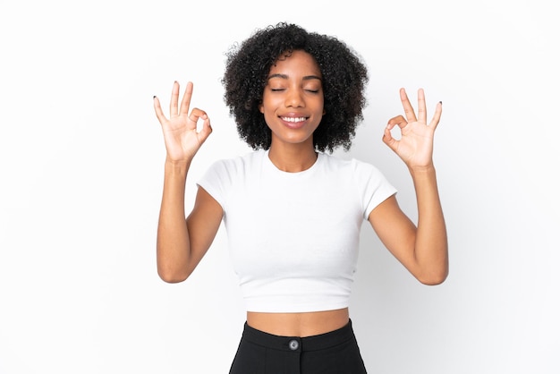 Young African American woman isolated on white background in zen pose