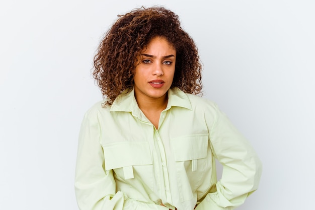 Young african american woman isolated on white wall having a liver pain, stomach ache