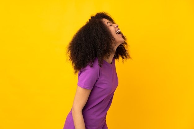 Young african american woman laughing in lateral position