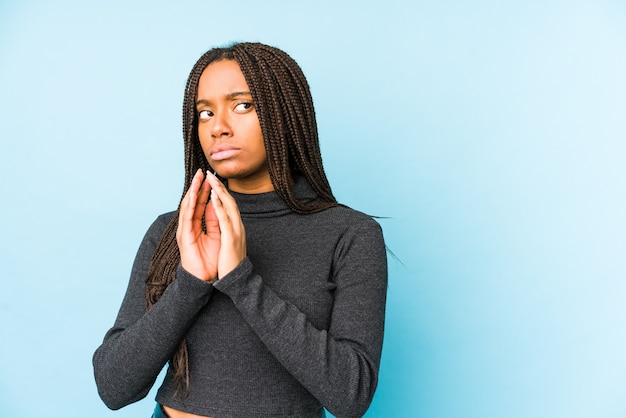 Young african american woman making up plan in mind, setting up an idea.