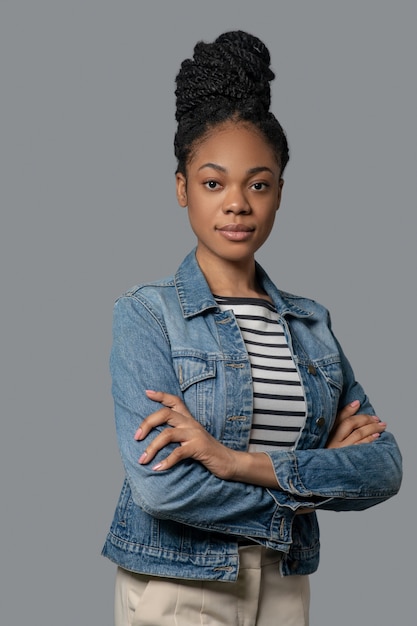 Young african american woman. Picture of a dark-skinned woman with hair bun