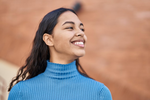 Young african american woman smiling confident standing at street