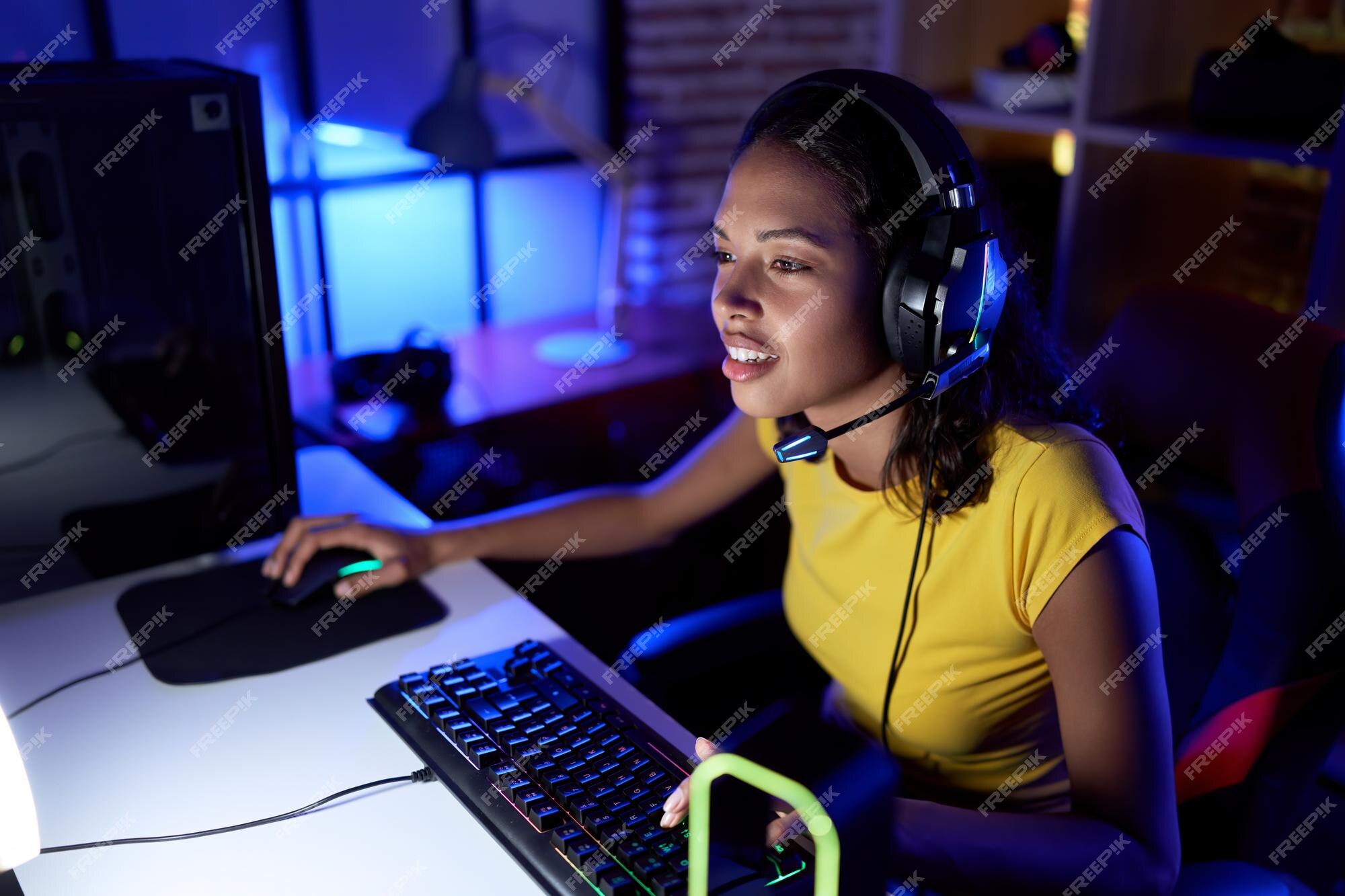 Premium Photo  Girl enjoying her free time by playing video games on  computer in game room