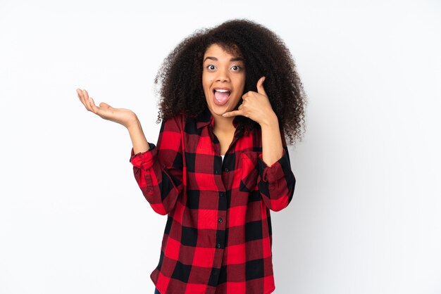 Young african american woman over wall making phone gesture and doubting