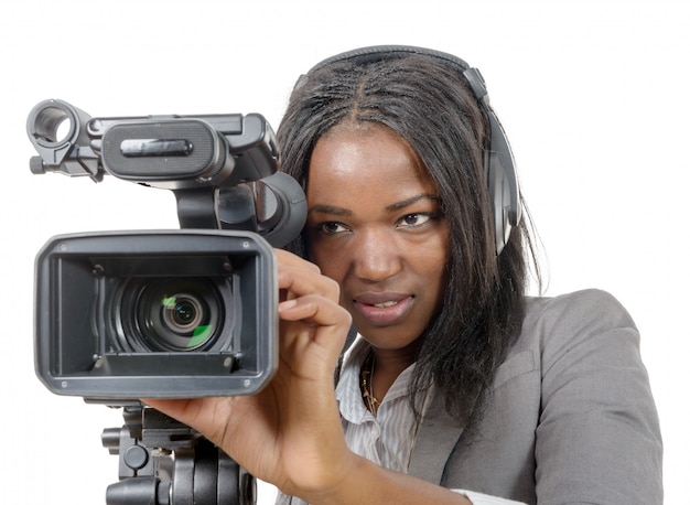 Young African American women with professional video camera and headphone