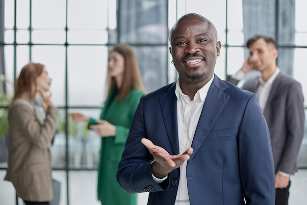 Young african businessman holding up his open palm