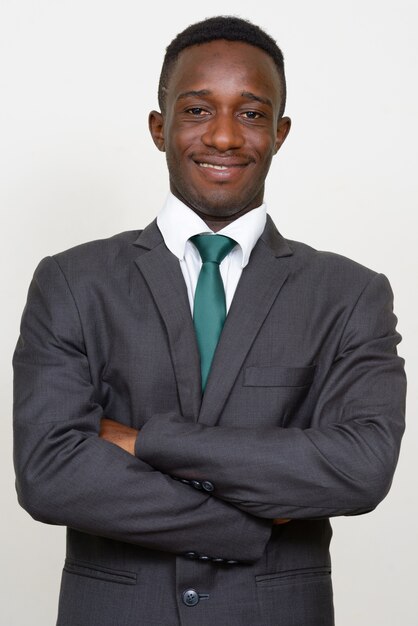 young African businessman in suit isolated against white space