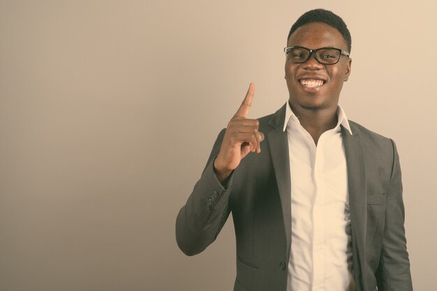 young African businessman wearing suit and eyeglasses