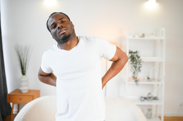 Photo young african man having back pain