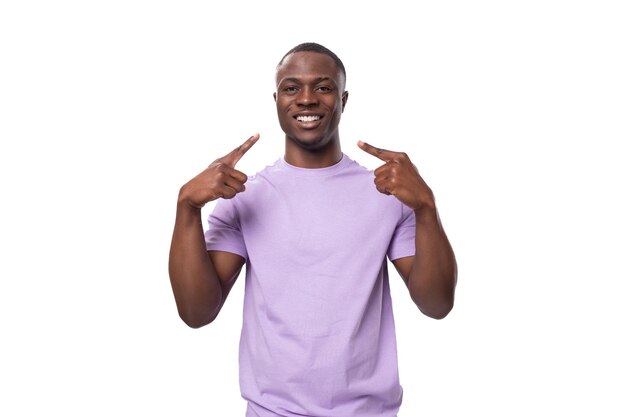 Young african man of normal build dressed in a basic light lilac tshirt with print mockup