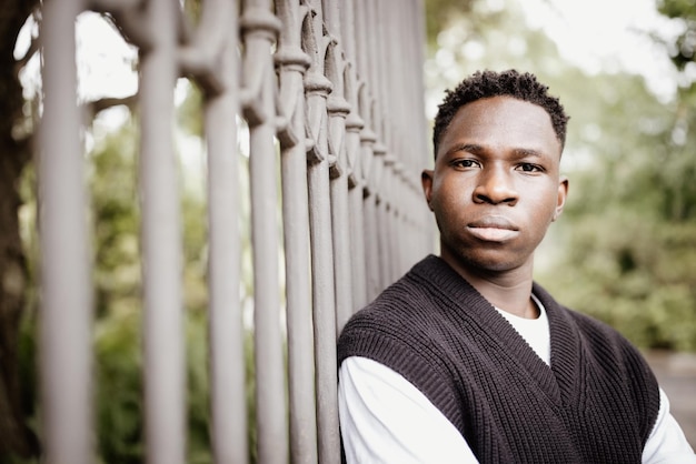 Young African man outdoor street portrait Fall or spring season