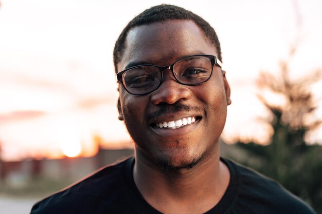 Young african man portrait standing in the street