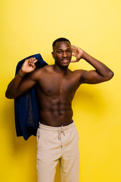 Young african man standing shirtless with a happy and cool smile on face lucky person