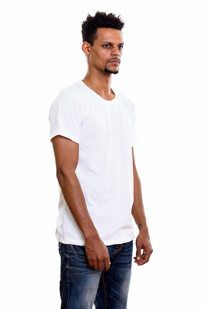 young African man standing while thinking isolated on white