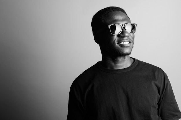 young African man wearing black shirt. black and white