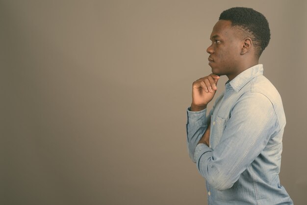 young African man wearing denim shirt