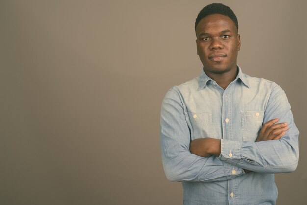 young African man wearing denim shirt