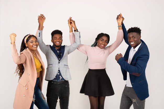 young african people on white background with hands raised up