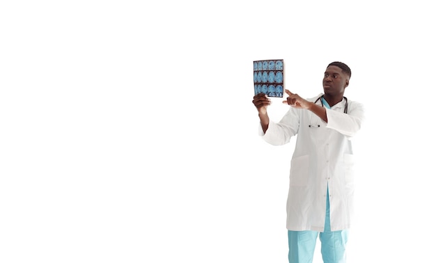 A young AfricanAmerican male doctor reads and views an MRI scan of the brain