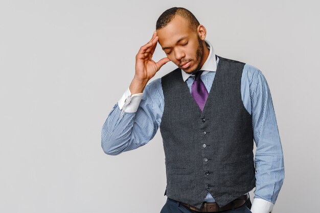 Young afro american businessman touching head because of headache and stress