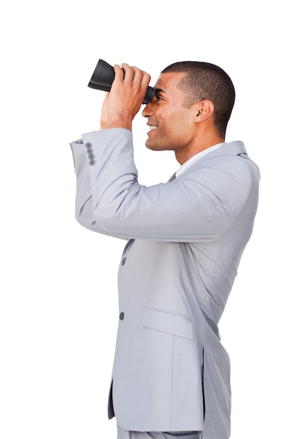 Young afro-american businessman using binoculars 