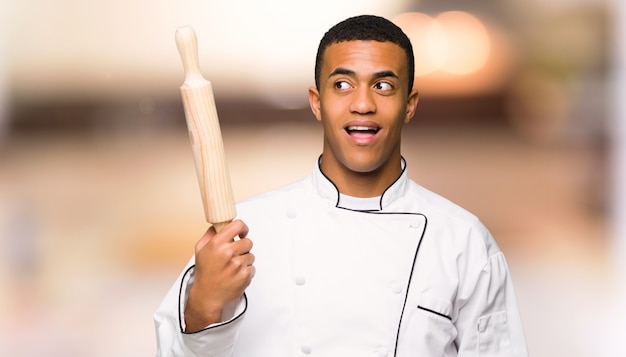 Young afro american chef man intending to realizes the solution