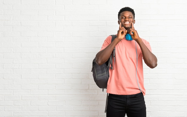 Young afro american man student smiling with a happy and pleasant expression