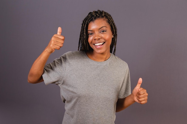 Young afro brazilian woman celebrating positivity