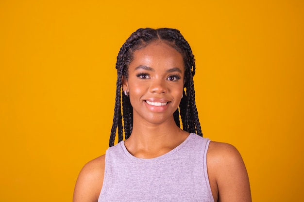 Young afro brazilian woman smiling looking at camera