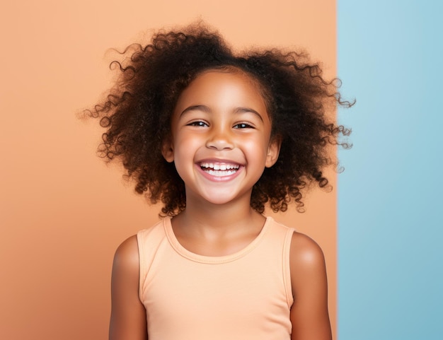 a young afro girl smiles on a white background