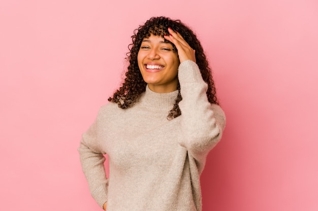 Young afro woman isolated joyful laughing a lot. Happiness concept