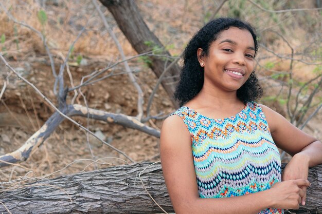 Young Afro woman smiling outdoors