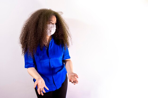 Young afrohaired girl with medical mask Coronavirus concept