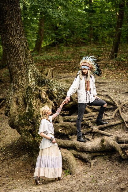 Young american indian couple holding hands.