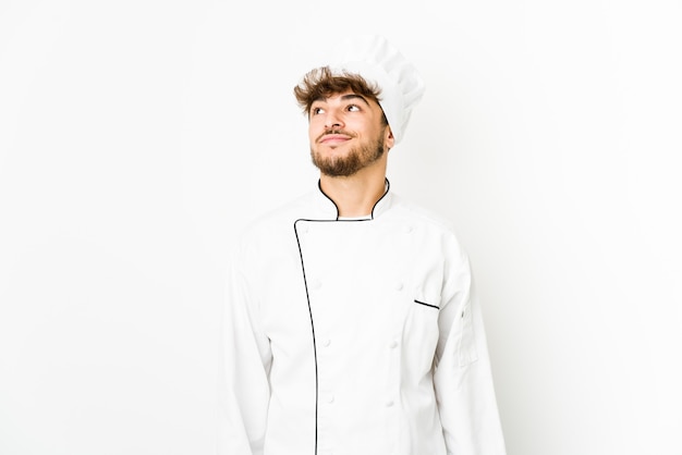 Young arab cook man dreaming of achieving goals and purposes