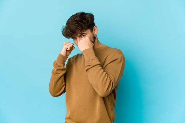 Young arab man expressing emotions isolated