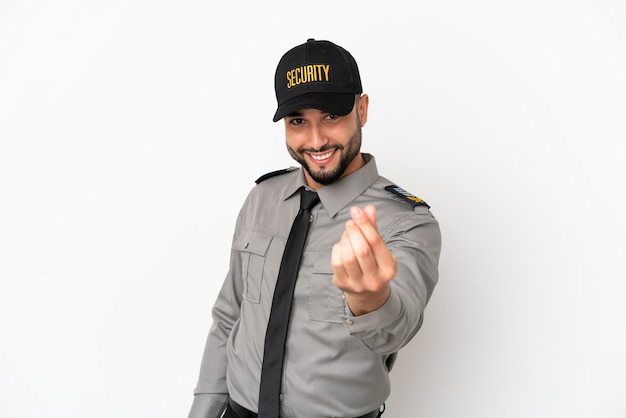 Young arab man isolated on white background making money gesture