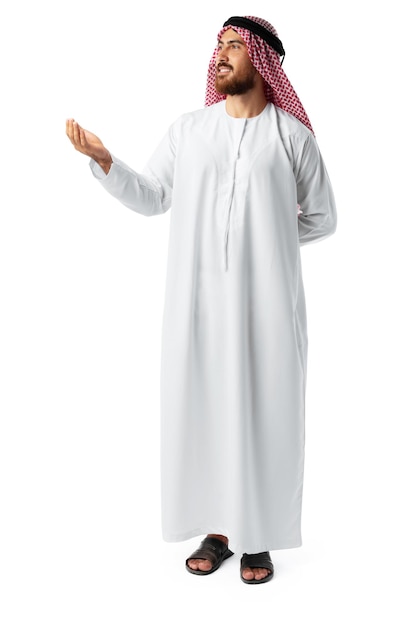 Young Arab man pointing hand isolated on white background