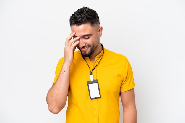 young arab man with id card isolated on white background laughing