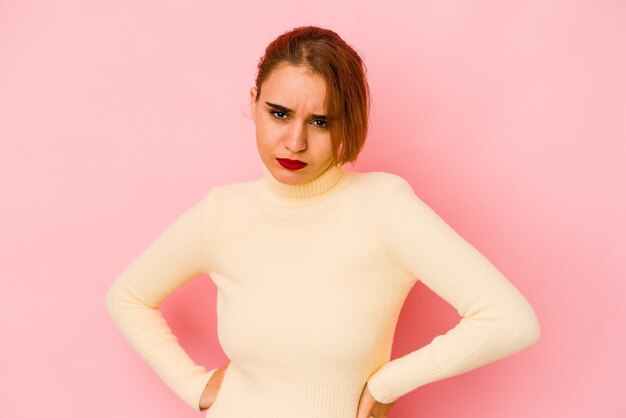 Young arab mixed race woman frowning face in displeasure, keeps arms folded.